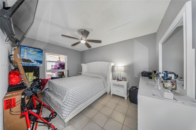 359 E 19th St, Hialeah, FL 33010 - bedroom with a textured ceiling, light tile patterned flooring, and a ceiling fan