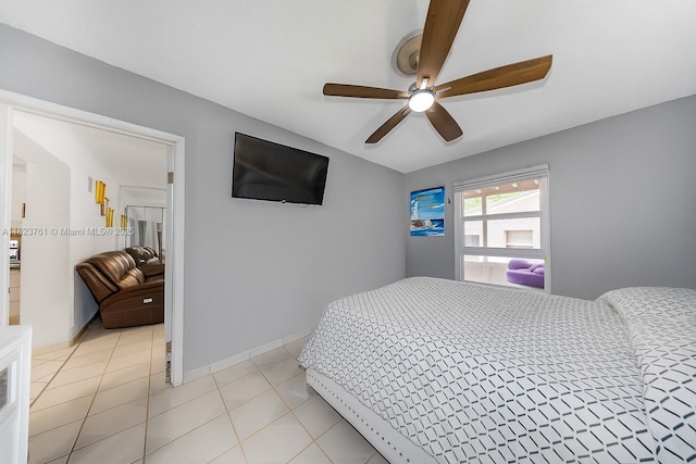359 E 19th St, Hialeah, FL 33010 - bedroom featuring light tile patterned flooring and ceiling fan