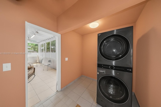 359 E 19th St, Hialeah, FL 33010 - laundry area with stacked washing machine and dryer and light tile patterned floors