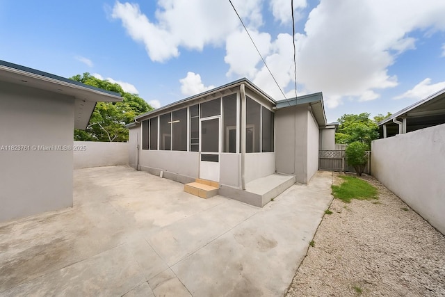 359 E 19th St, Hialeah, FL 33010 - back of property with a sunroom and a patio area