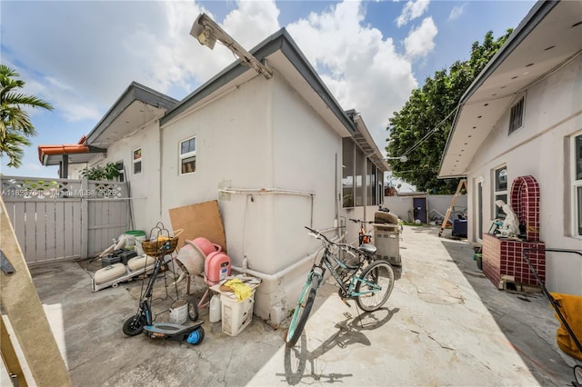 359 E 19th St, Hialeah, FL 33010 - view of side of property featuring a patio area and stucco siding