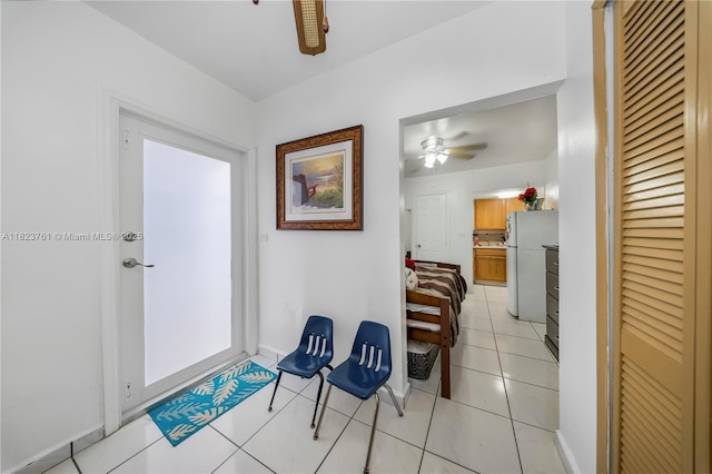 359 E 19th St, Hialeah, FL 33010 - hall with light tile patterned flooring and baseboards