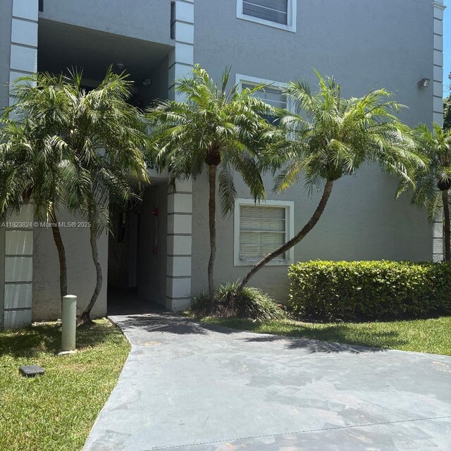 17255 SW 95th Ave Unit 153, Palmetto Bay, FL 33157 - view of home's exterior featuring stucco siding