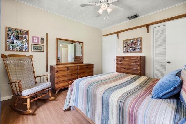 404 NE 11th Ave, Pompano Beach, FL 33060 - bedroom featuring wood finished floors, a closet, ornamental molding, and a ceiling fan
