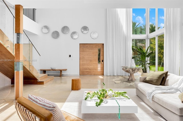 10620 SW 74th Ave, Pinecrest, FL 33156 - living room featuring a high ceiling and stairs