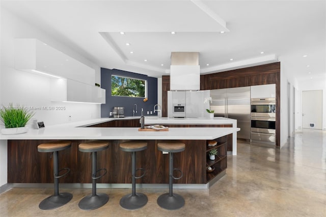 10620 SW 74th Ave, Pinecrest, FL 33156 - kitchen with modern cabinets, stainless steel appliances, open shelves, light countertops, and a peninsula