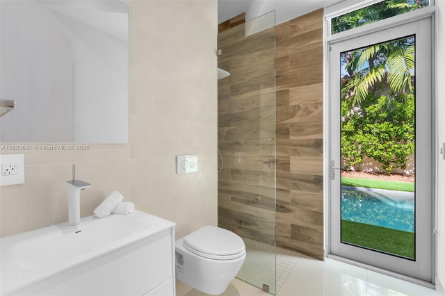 10620 SW 74th Ave, Pinecrest, FL 33156 - bathroom featuring tile walls, vanity, walk in shower, and tile patterned flooring