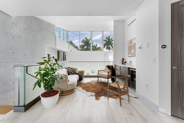 10620 SW 74th Ave, Pinecrest, FL 33156 - living area featuring a high ceiling and light wood-style floors
