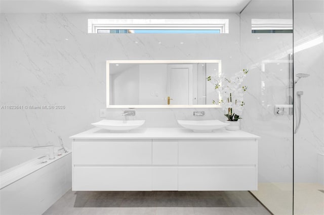 10620 SW 74th Ave, Pinecrest, FL 33156 - full bath featuring tile walls, double vanity, a garden tub, and a marble finish shower
