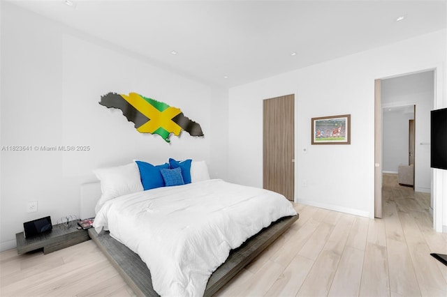 10620 SW 74th Ave, Pinecrest, FL 33156 - bedroom with light wood-style flooring and baseboards
