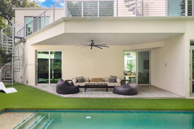 10620 SW 74th Ave, Pinecrest, FL 33156 - rear view of property with stucco siding, a ceiling fan, an outdoor living space, and a balcony