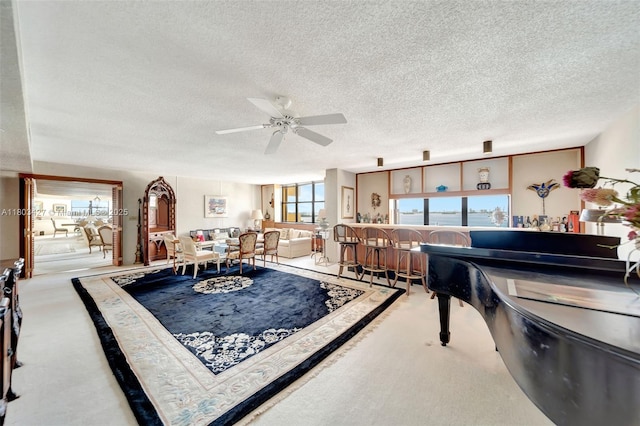 1800 NE 114th St Unit 604, Miami, FL 33181 - living room with a textured ceiling, ceiling fan, and carpet