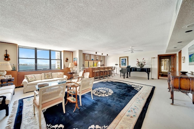 1800 NE 114th St Unit 604, Miami, FL 33181 - living room with a textured ceiling, ceiling fan, a water view, and carpet