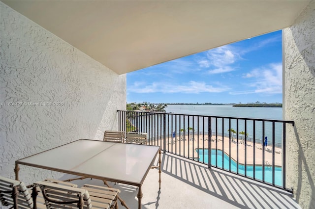 1800 NE 114th St Unit 604, Miami, FL 33181 - balcony with a water view and view of pool area
