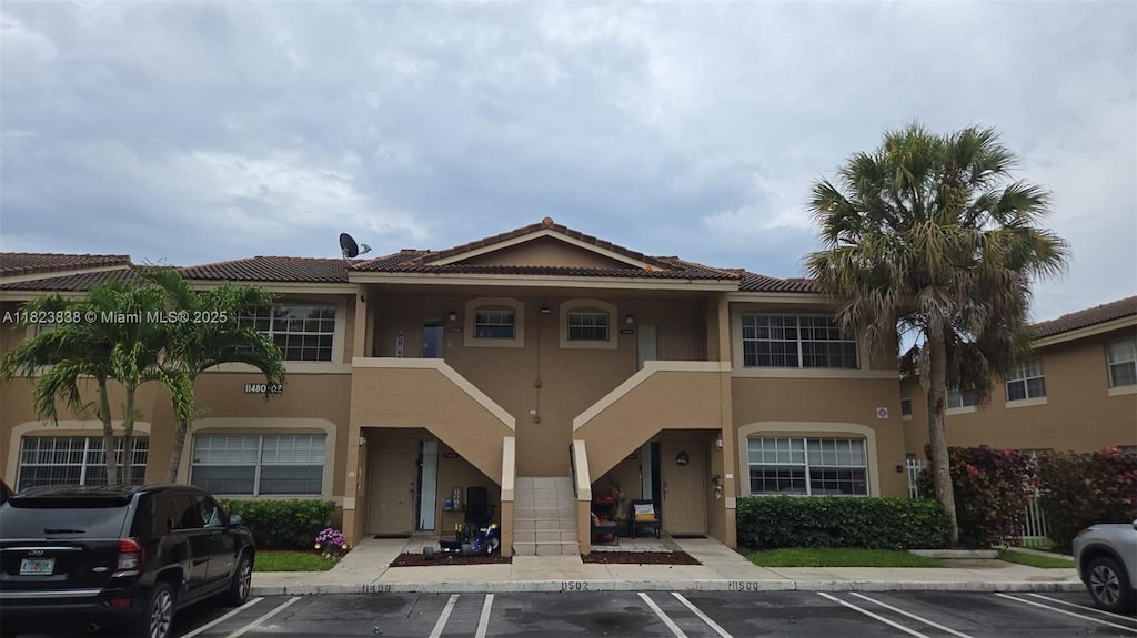 11502 NW 43rd St Unit 11502, Coral Springs, FL 33065 - view of building exterior featuring uncovered parking
