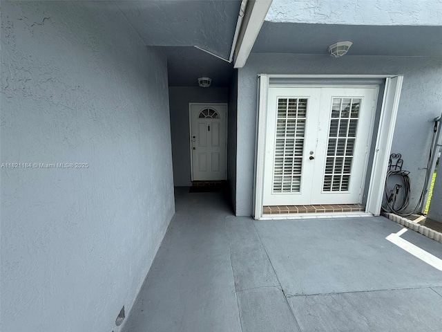 14251 SW 96th Ter Unit 14251, Miami, FL 33186 - view of exterior entry with french doors and stucco siding