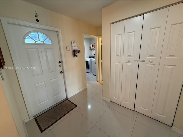 14251 SW 96th Ter Unit 14251, Miami, FL 33186 - entryway with light tile patterned floors and separate washer and dryer
