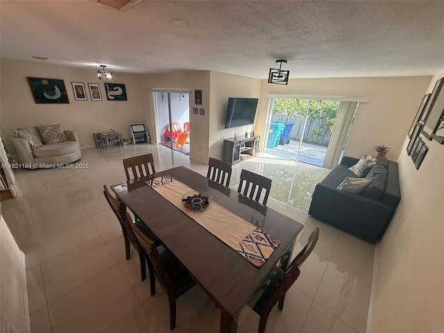 14251 SW 96th Ter Unit 14251, Miami, FL 33186 - dining space featuring tile patterned flooring and a chandelier