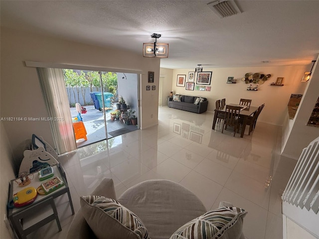 14251 SW 96th Ter Unit 14251, Miami, FL 33186 - tiled dining area with a textured ceiling and baseboards