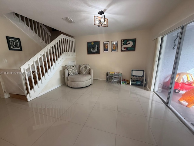 14251 SW 96th Ter Unit 14251, Miami, FL 33186 - living area with stairway and tile patterned flooring