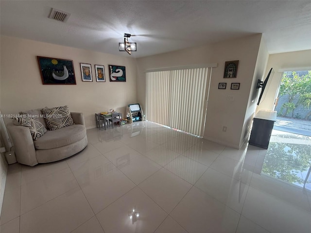 14251 SW 96th Ter Unit 14251, Miami, FL 33186 - living area with baseboards and tile patterned floors