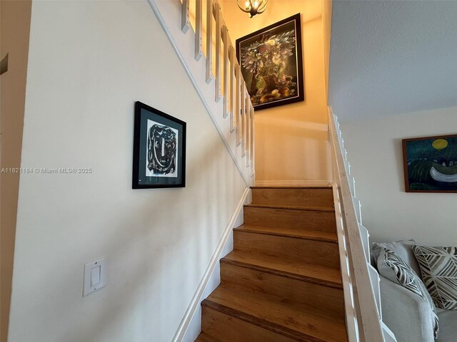 14251 SW 96th Ter Unit 14251, Miami, FL 33186 - staircase featuring baseboards and wood finished floors