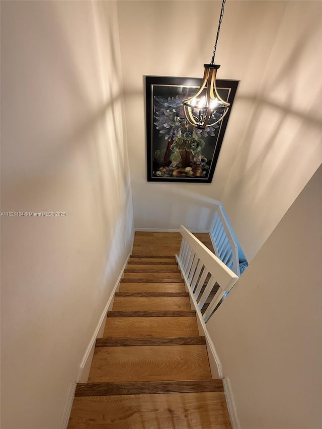 14251 SW 96th Ter Unit 14251, Miami, FL 33186 - stairway with wood finished floors and a chandelier