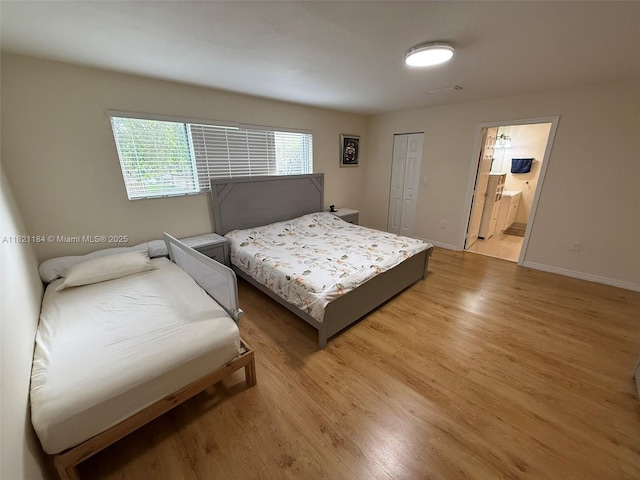14251 SW 96th Ter Unit 14251, Miami, FL 33186 - bedroom featuring light wood-type flooring, ensuite bathroom, and a closet