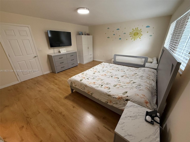 14251 SW 96th Ter Unit 14251, Miami, FL 33186 - bedroom with light wood-type flooring and baseboards