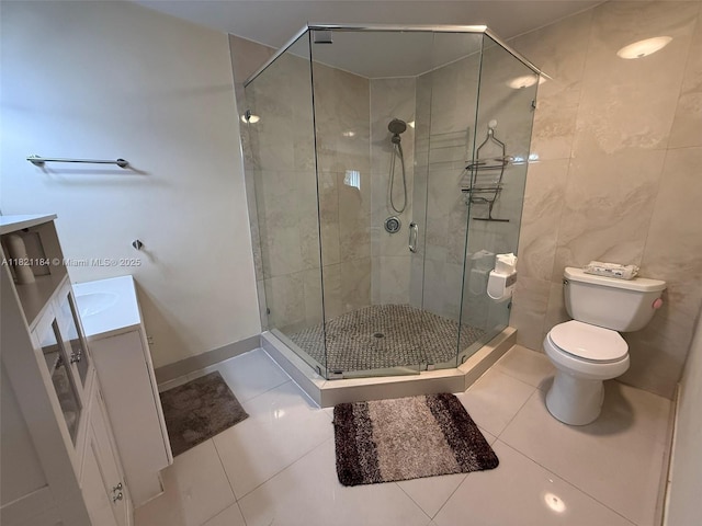 14251 SW 96th Ter Unit 14251, Miami, FL 33186 - bathroom featuring vanity, tile patterned flooring, a stall shower, and tile walls