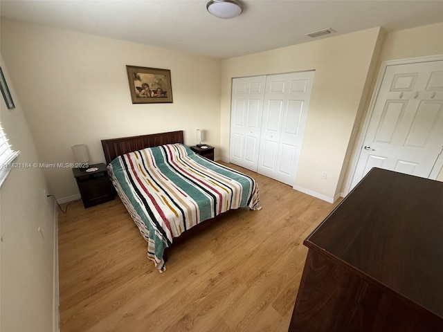 14251 SW 96th Ter Unit 14251, Miami, FL 33186 - bedroom featuring light wood-style floors and a closet