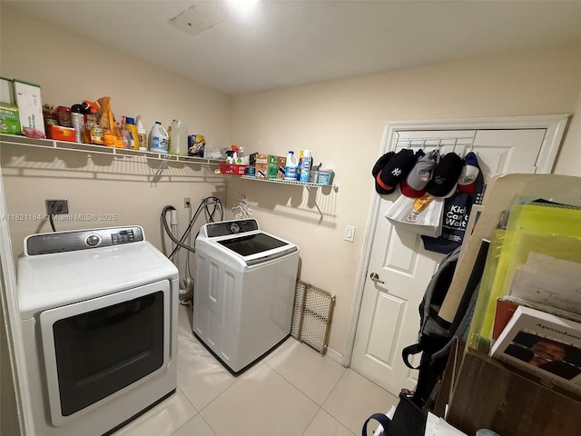 14251 SW 96th Ter Unit 14251, Miami, FL 33186 - washroom with washer and dryer and light tile patterned floors