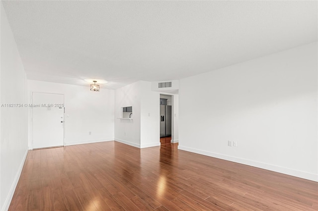 1912 Monroe St Unit 201, Hollywood, FL 33020 - spare room with wood finished floors and baseboards