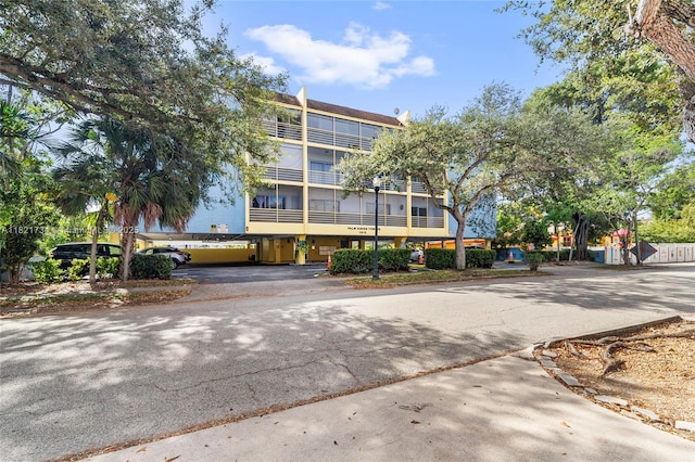 1912 Monroe St Unit 201, Hollywood, FL 33020 - view of building exterior featuring asphalt driveway
