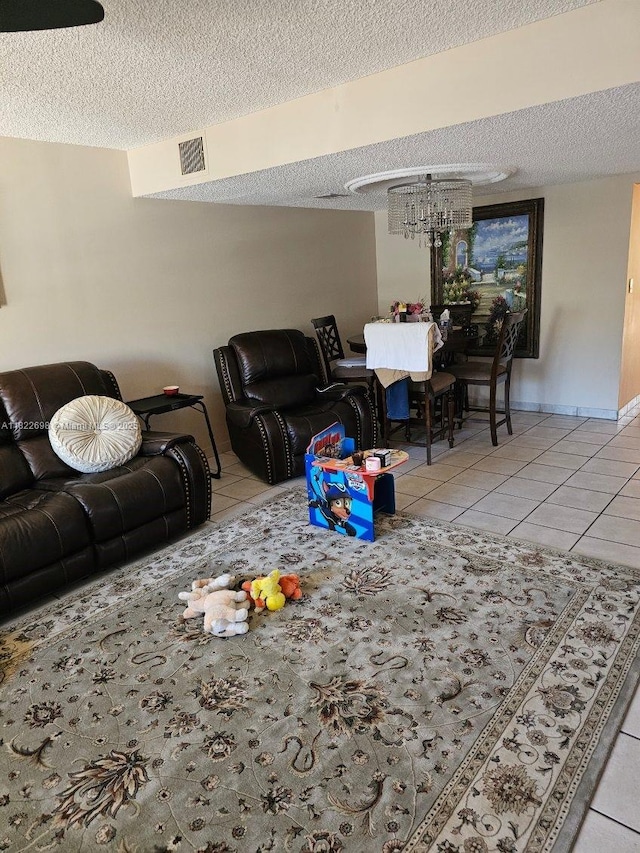 2423 NE 10th St Unit 154, Hallandale Beach, FL 33009 - living room featuring tile patterned floors, a textured ceiling, and a chandelier
