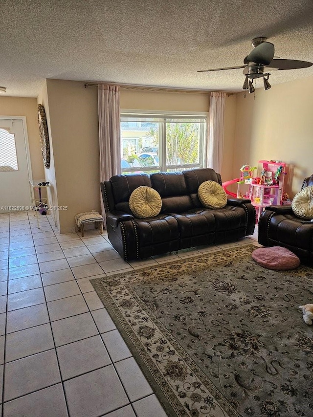 2423 NE 10th St Unit 154, Hallandale Beach, FL 33009 - living room with light tile patterned floors, a textured ceiling, and ceiling fan