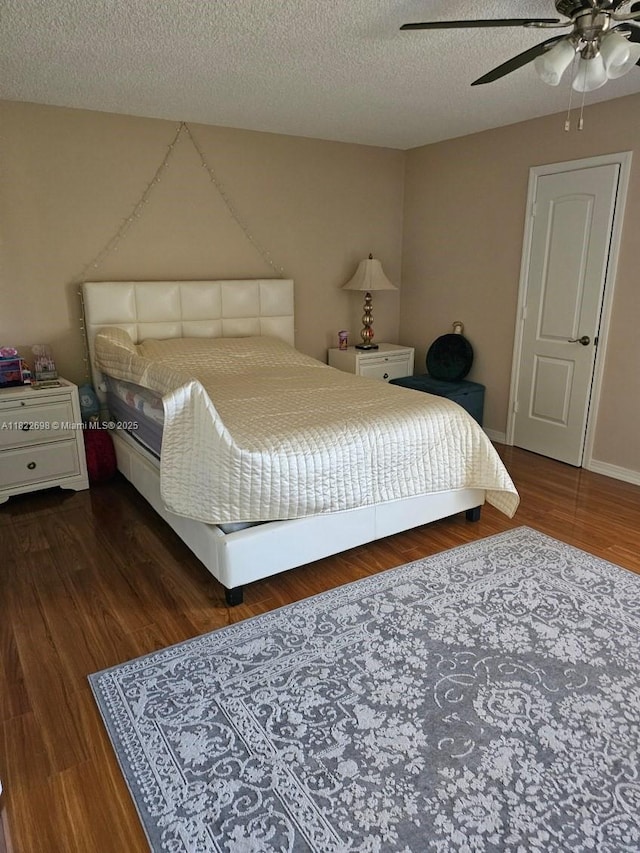 2423 NE 10th St Unit 154, Hallandale Beach, FL 33009 - bedroom with wood finished floors, ceiling fan, and a textured ceiling