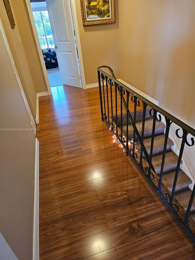 2423 NE 10th St Unit 154, Hallandale Beach, FL 33009 - stairs featuring wood finished floors and baseboards