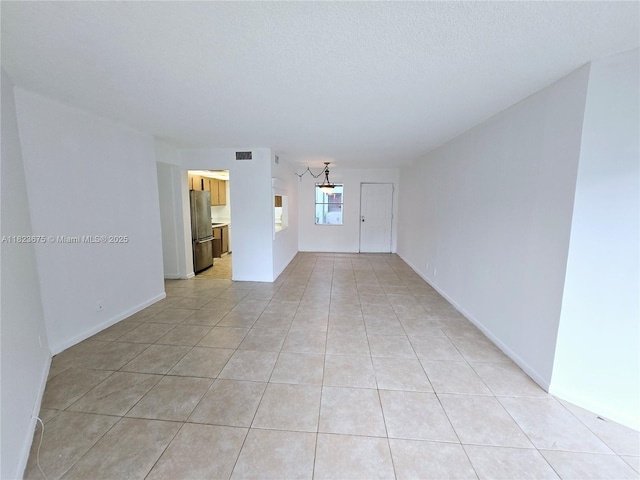 1820 N Congress Ave Unit 108, West Palm Beach, FL 33401 - unfurnished room featuring light tile patterned floors and baseboards