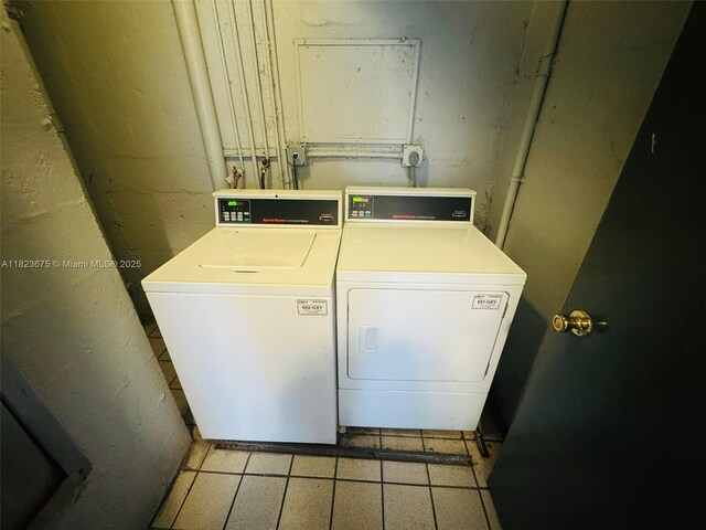 1820 N Congress Ave Unit 108, West Palm Beach, FL 33401 - laundry area with washing machine and clothes dryer
