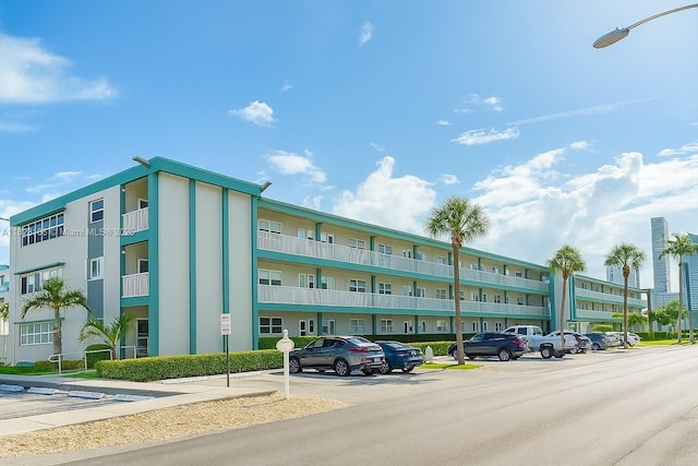 3923 NE 166th St Unit N208, North Miami Beach, FL 33160 - view of building exterior featuring uncovered parking