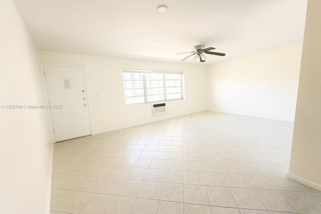3923 NE 166th St Unit N208, North Miami Beach, FL 33160 - empty room with ceiling fan, a wall unit AC, light tile patterned floors, and a smoke detector