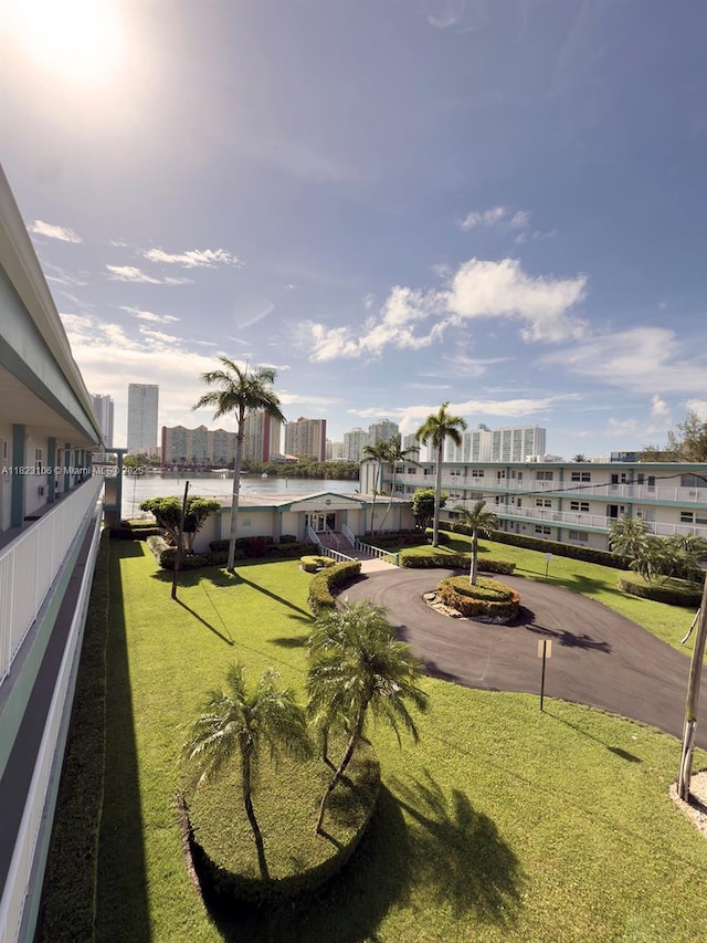 3923 NE 166th St Unit N208, North Miami Beach, FL 33160 - view of grassy yard featuring a balcony and a view of city