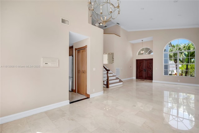 1020 NW 184th Ter, Pembroke Pines, FL 33029 - entrance foyer with a chandelier, high vaulted ceiling, stairs, light marble finish flooring, and ornamental molding
