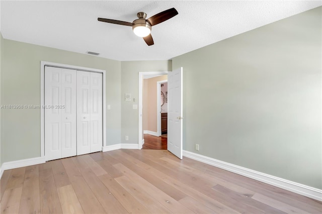 1020 NW 184th Ter, Pembroke Pines, FL 33029 - unfurnished bedroom with light wood-style flooring, a closet, and a ceiling fan