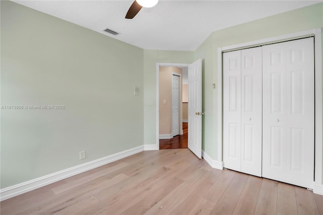 1020 NW 184th Ter, Pembroke Pines, FL 33029 - unfurnished bedroom featuring light wood finished floors, a closet, a ceiling fan, and a textured ceiling