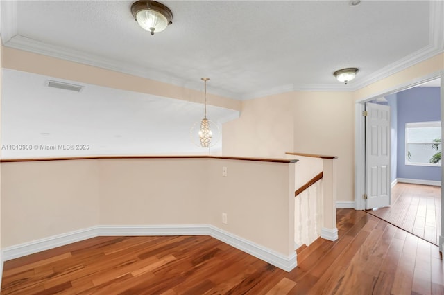 1020 NW 184th Ter, Pembroke Pines, FL 33029 - hall featuring an upstairs landing, hardwood / wood-style flooring, ornamental molding, and a chandelier
