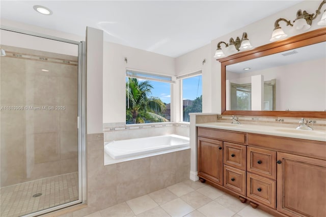 1020 NW 184th Ter, Pembroke Pines, FL 33029 - bathroom with double vanity, a bath, a shower stall, and tile patterned flooring