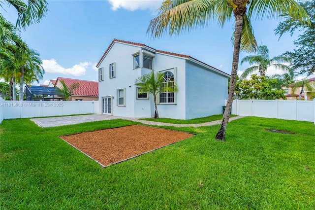 1020 NW 184th Ter, Pembroke Pines, FL 33029 - rear view of property featuring stucco siding, a fenced backyard, a patio, and a tile roof