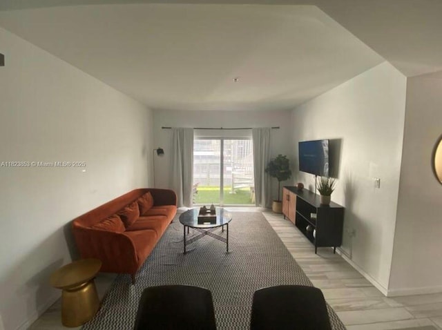 481 NE 29th St Unit 706, Miami, FL 33137 - living area with baseboards and light wood-style flooring